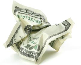 crumpled bill symbolizing looted america